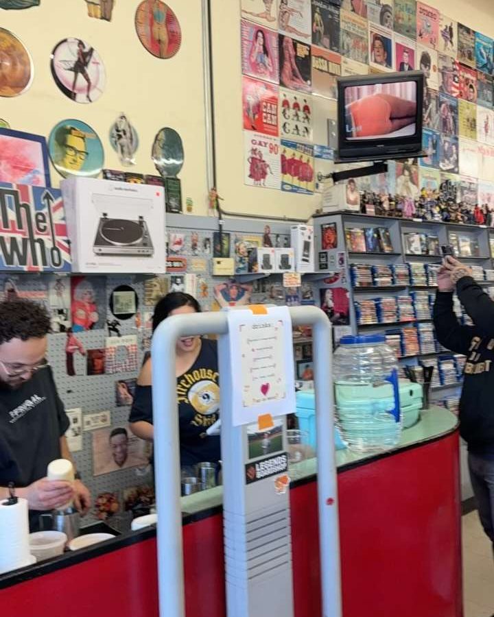 Pouring drinks at the Ffrugal counter inside Lovell's Records